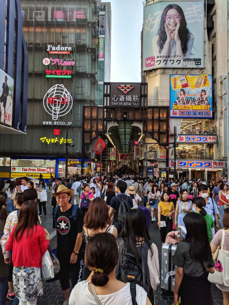 Osaka, Japan Foodie Travelogue - Street view in Namba Dotonburi. This view is taken on the bridge where one can see the Glico Running Man, towards Shinsaibashi, the busiest shopping street in Osaka.